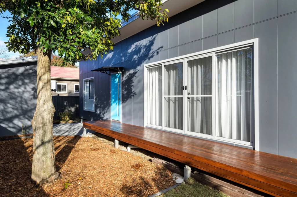granny flat with doors opening onto deck